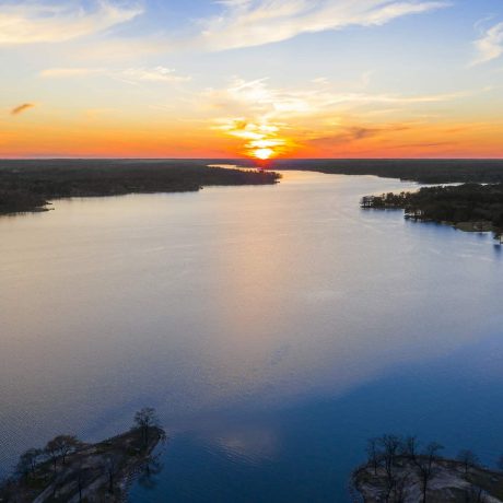 lake with sun setting int he background